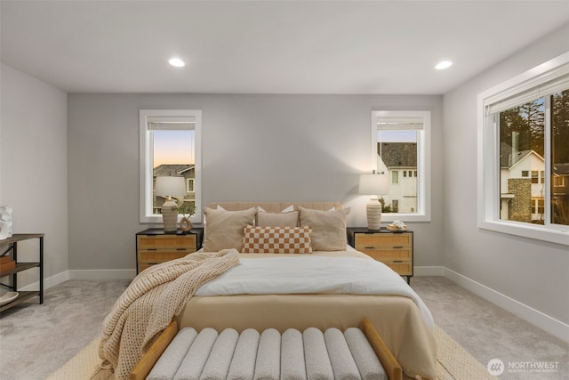 bedroom with recessed lighting, baseboards, and light colored carpet