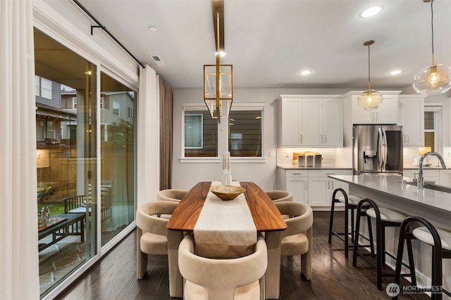 dining area featuring recessed lighting, visible vents, and dark wood-style flooring