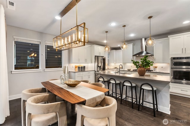 dining space featuring recessed lighting, visible vents, baseboards, and dark wood-style flooring