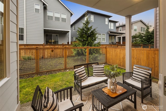 view of patio / terrace with an outdoor living space and fence