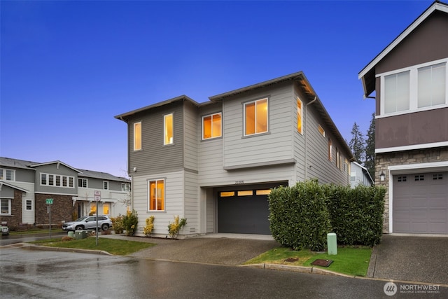 view of front facade featuring driveway and a garage