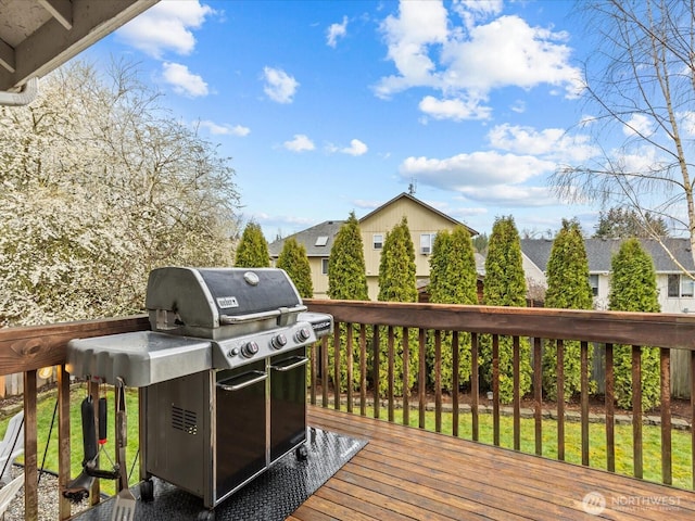 wooden terrace featuring area for grilling