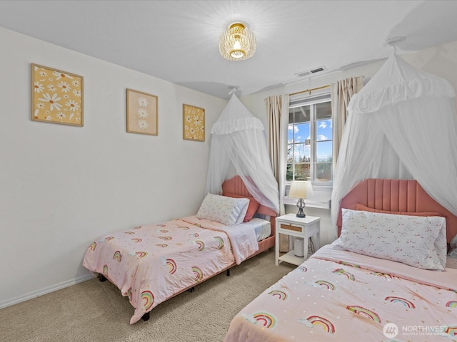 carpeted bedroom with baseboards and visible vents