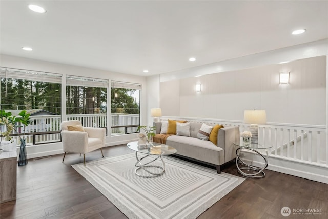 living room featuring recessed lighting and dark wood-style floors