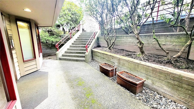 view of patio featuring stairway