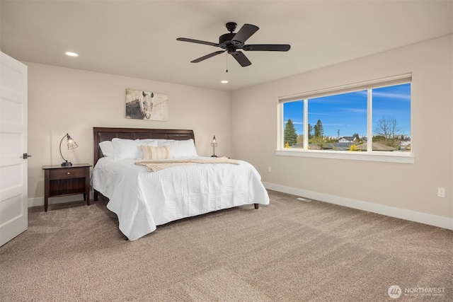 carpeted bedroom featuring a ceiling fan, recessed lighting, and baseboards