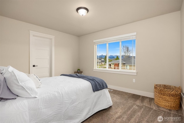 carpeted bedroom with baseboards