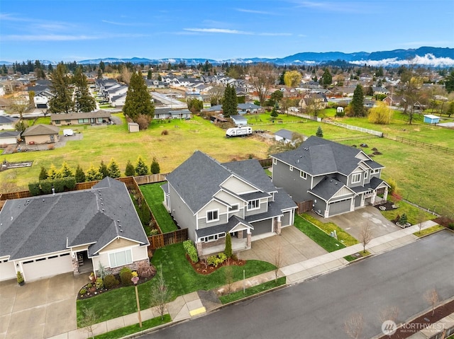 birds eye view of property featuring a mountain view and a residential view