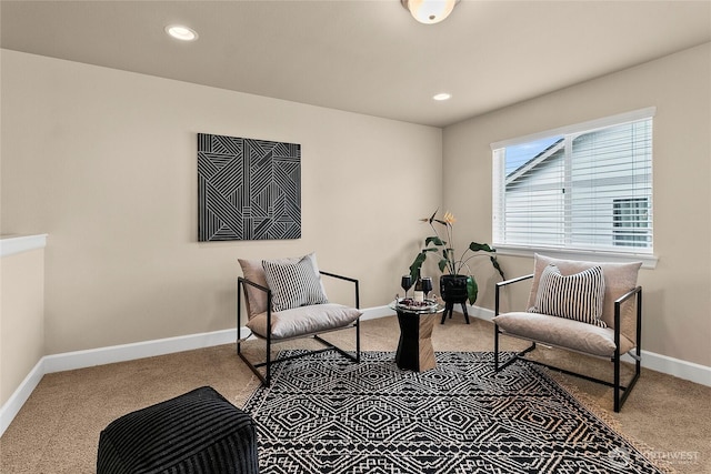 living area with recessed lighting, baseboards, and carpet floors