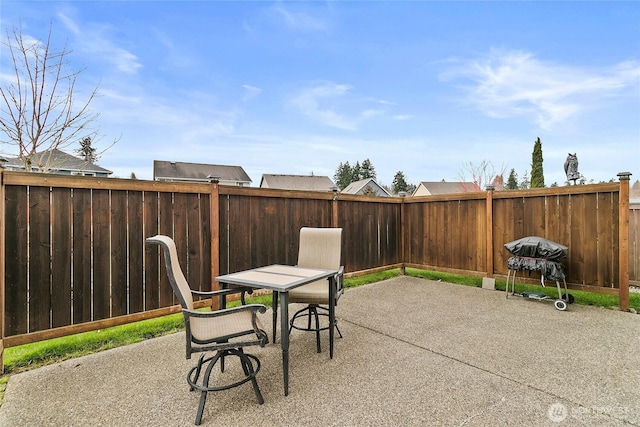 view of patio / terrace featuring area for grilling and a fenced backyard