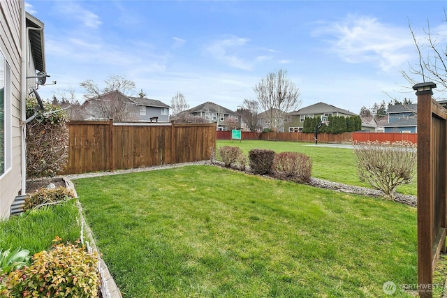 view of yard featuring a residential view and fence private yard