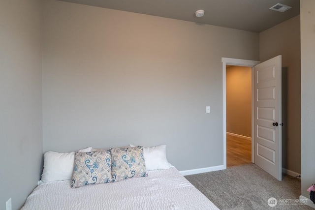 bedroom featuring carpet flooring, baseboards, and visible vents