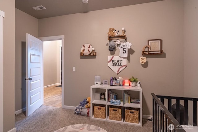 bedroom featuring visible vents, baseboards, and carpet