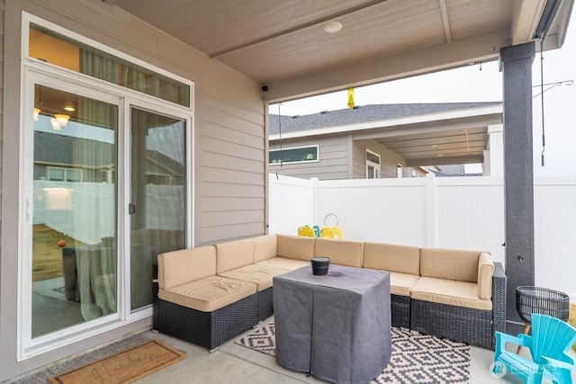 view of patio featuring an outdoor hangout area and fence