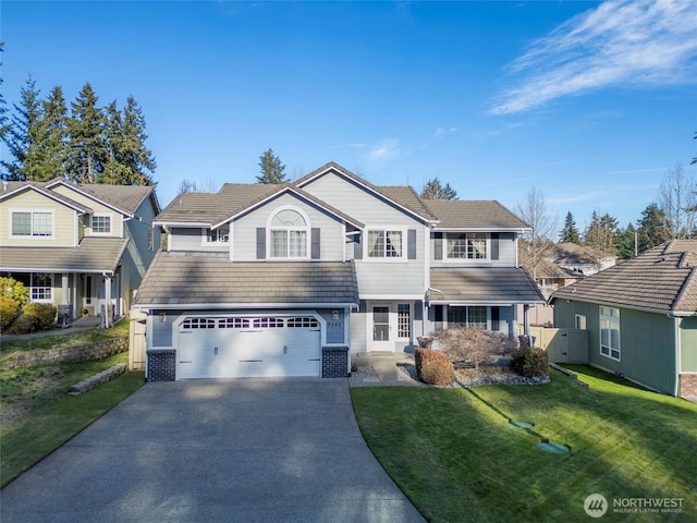 view of front facade featuring an attached garage, driveway, a tile roof, and a front lawn