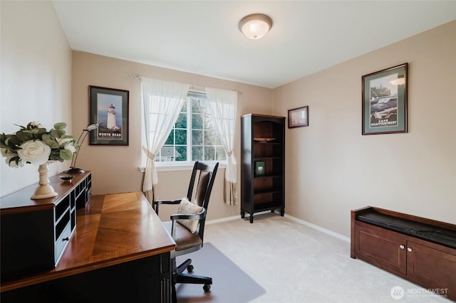 home office featuring light colored carpet and baseboards