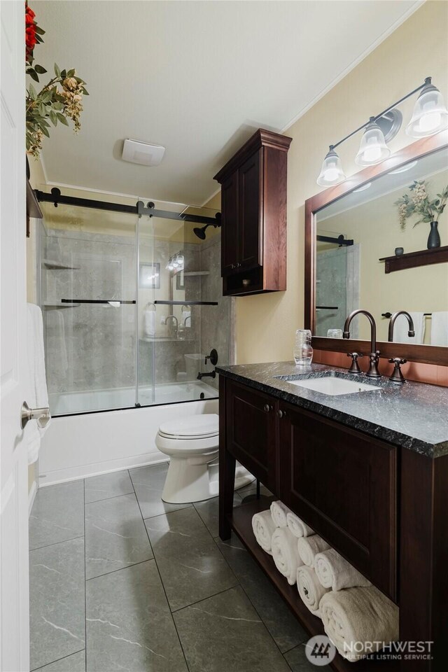 full bathroom with tile patterned floors, crown molding, toilet, enclosed tub / shower combo, and vanity