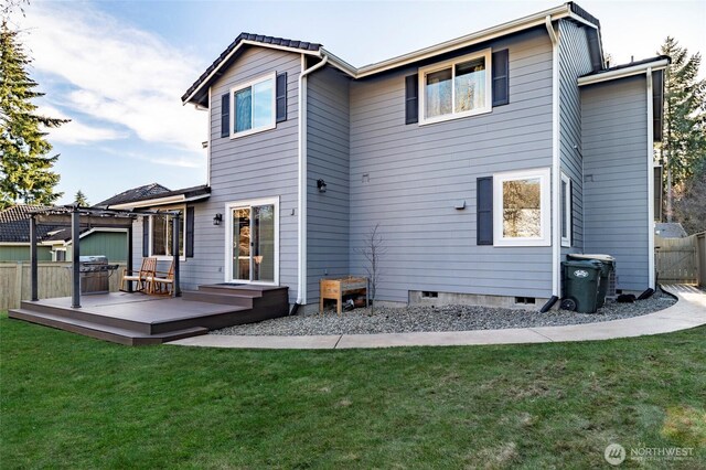 rear view of property featuring a pergola, fence, a yard, a wooden deck, and crawl space