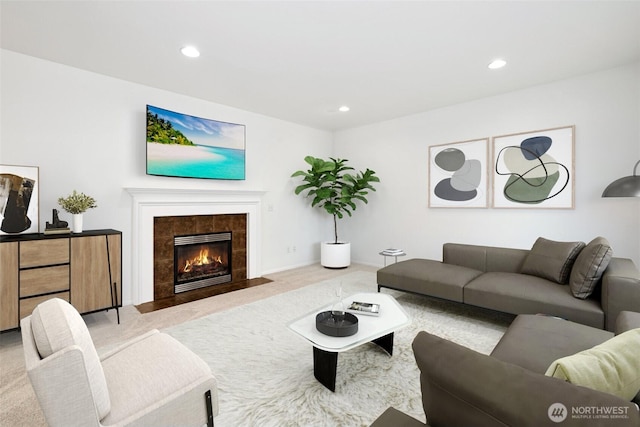 carpeted living room with recessed lighting, a fireplace, and baseboards