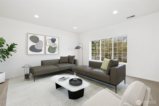 living area with visible vents, recessed lighting, baseboards, and carpet floors