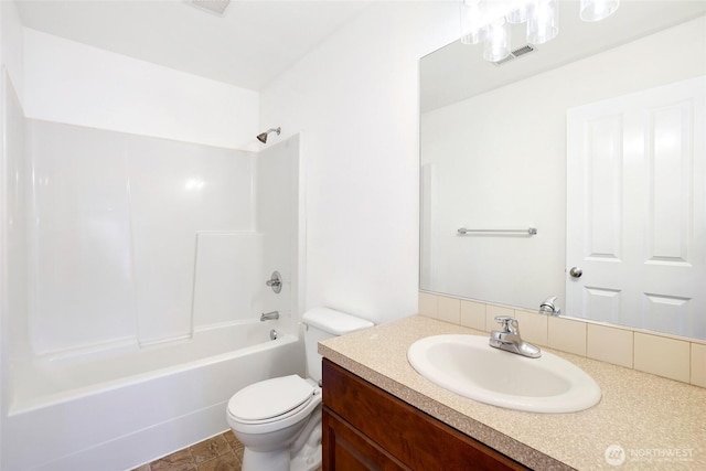 bathroom featuring vanity, toilet, visible vents, and shower / bath combination