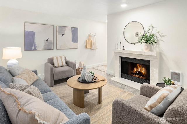 living room featuring visible vents, recessed lighting, a fireplace, and baseboards