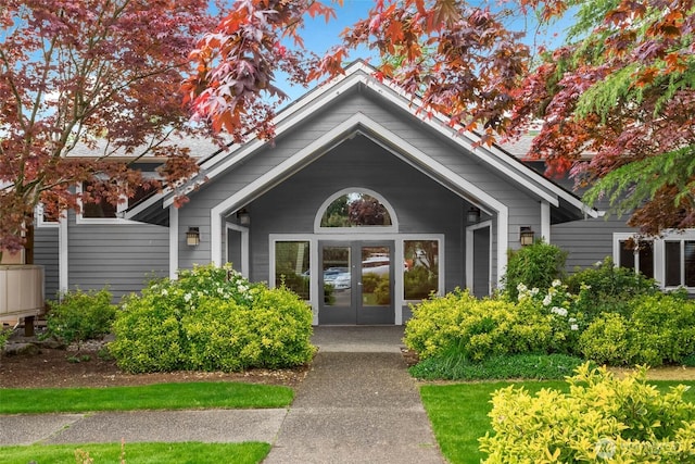 view of exterior entry featuring french doors