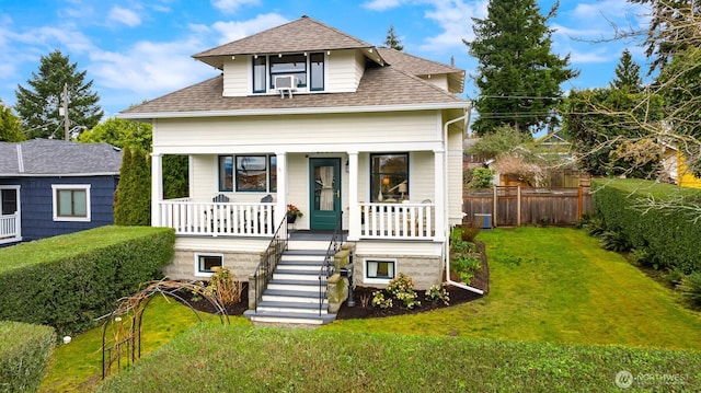 bungalow-style home with a front lawn, a porch, fence, a shingled roof, and stairs