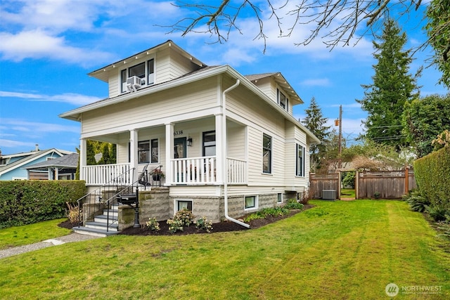 bungalow featuring a porch, central air condition unit, fence, and a front yard