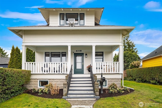 view of front of home featuring a porch and a front lawn