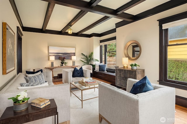 living room featuring beamed ceiling and light wood-type flooring