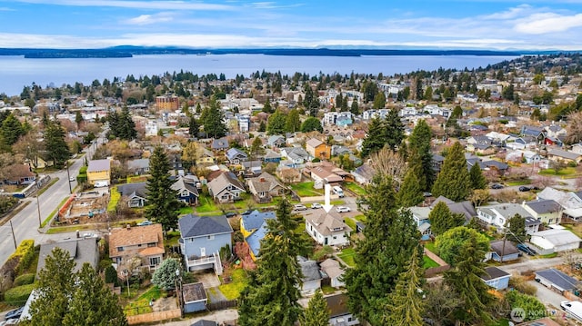 birds eye view of property with a residential view and a water view