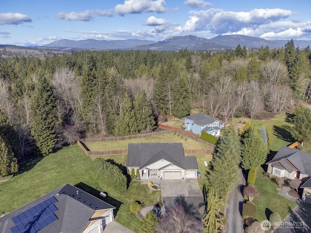 aerial view featuring a mountain view and a forest view