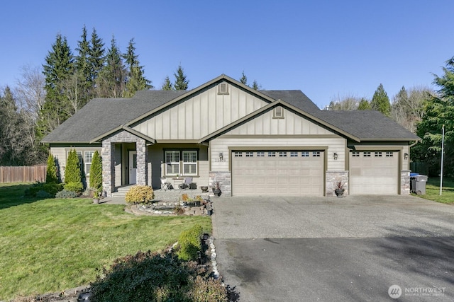 view of front of house with concrete driveway, a garage, board and batten siding, and stone siding