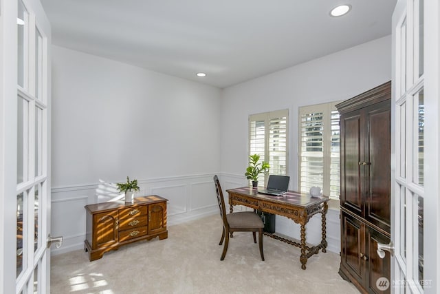 office area featuring a wainscoted wall, light carpet, recessed lighting, french doors, and a decorative wall