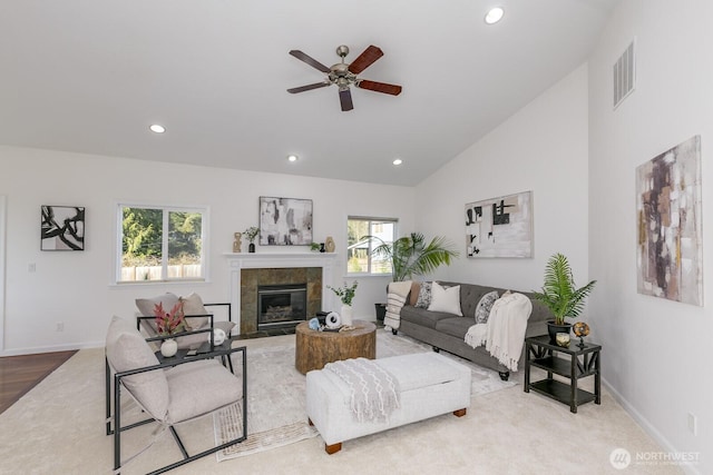 living room featuring visible vents, recessed lighting, and vaulted ceiling