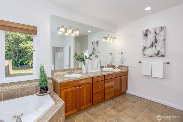 full bathroom featuring tile patterned floors, a garden tub, a sink, recessed lighting, and double vanity