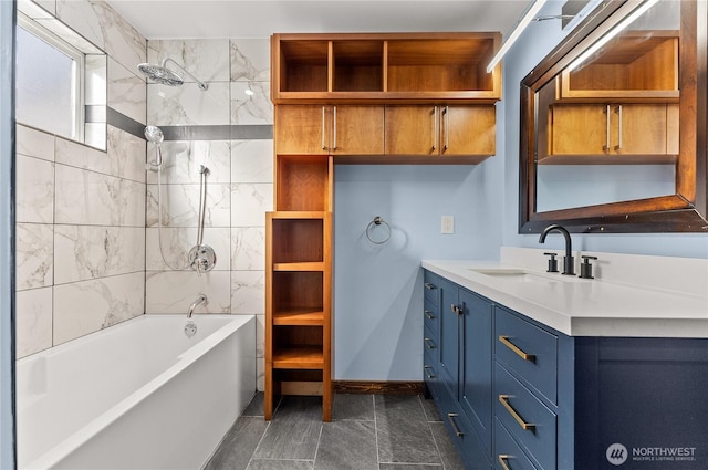 bathroom featuring vanity, shower / bath combination, and baseboards