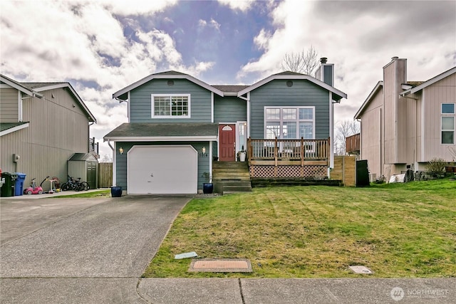 view of front of property with aphalt driveway, an attached garage, and a front lawn