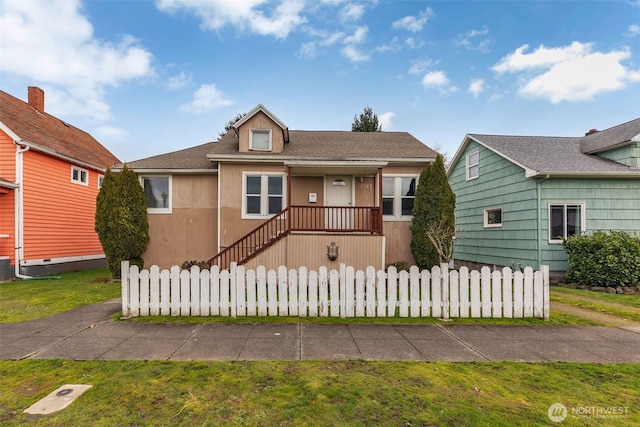 bungalow with a fenced front yard and roof with shingles