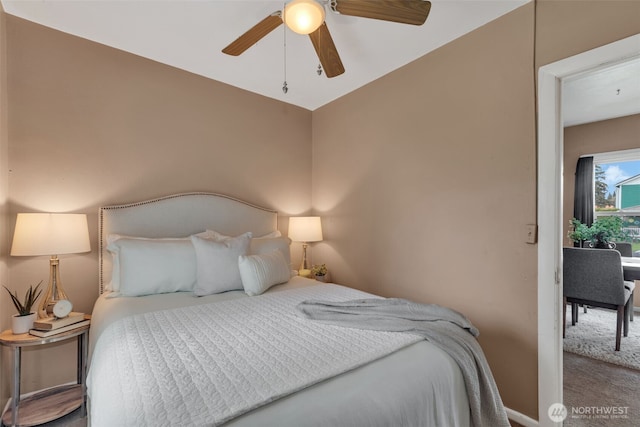 carpeted bedroom with a ceiling fan