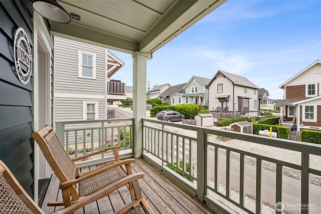 balcony featuring a residential view and a porch