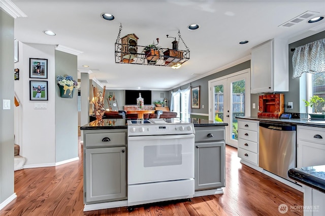 kitchen with white range with electric stovetop, dishwasher, dark countertops, and gray cabinetry