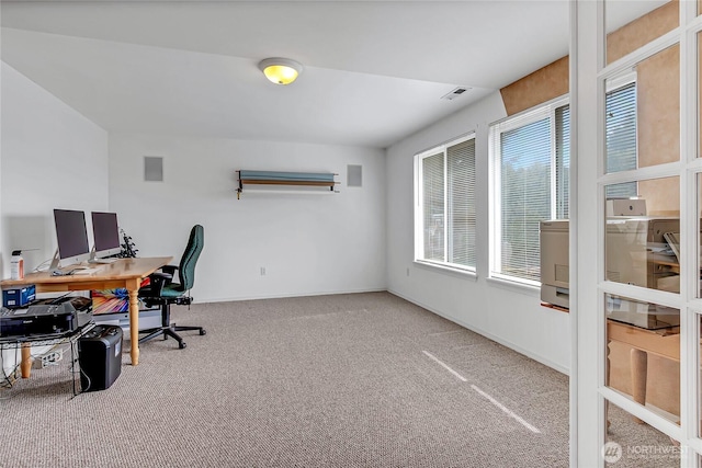 carpeted home office with visible vents and baseboards