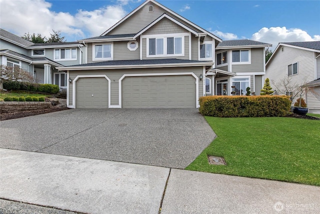 view of front facade with an attached garage, driveway, and a front yard