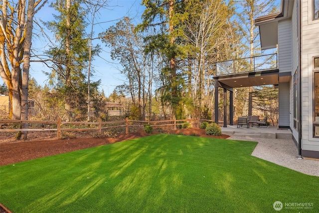 view of yard featuring a patio and fence