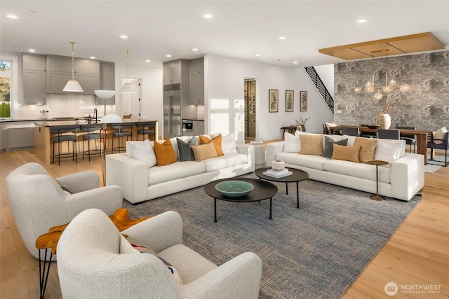 living room featuring recessed lighting and light wood-style flooring