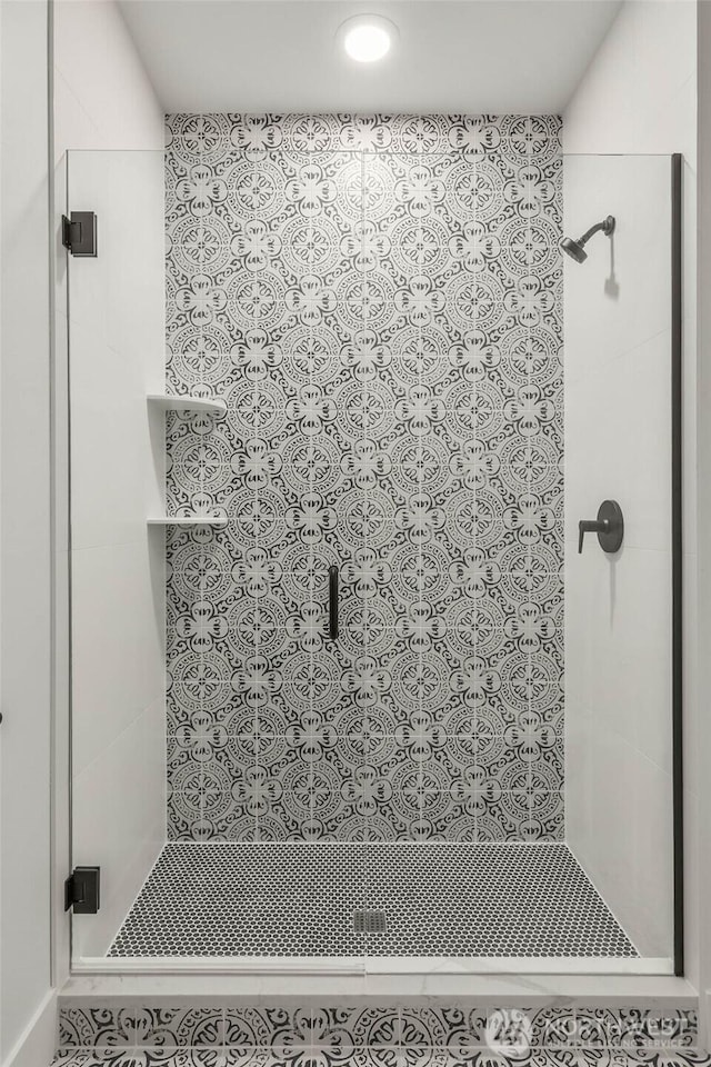 bathroom featuring a shower stall