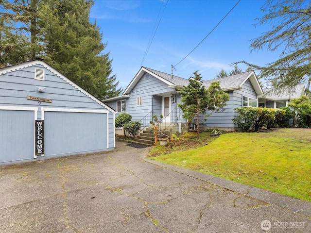 single story home with an outbuilding and a front yard