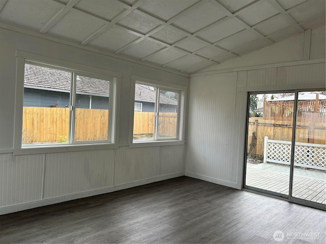 unfurnished sunroom featuring plenty of natural light, coffered ceiling, and vaulted ceiling